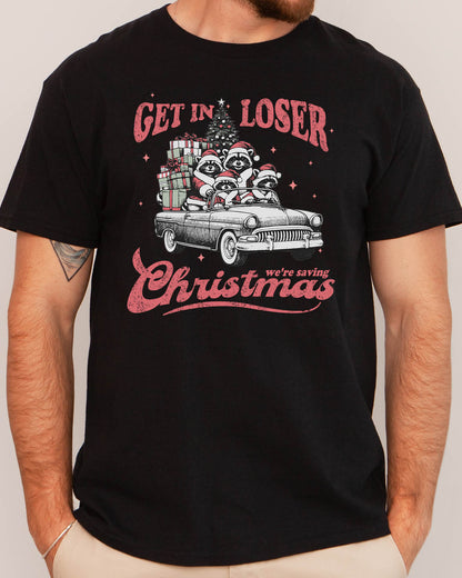 Man wearing "Get In Loser We're Saving Christmas" shirt in black color with a retro funny raccoon XMAS graphic
