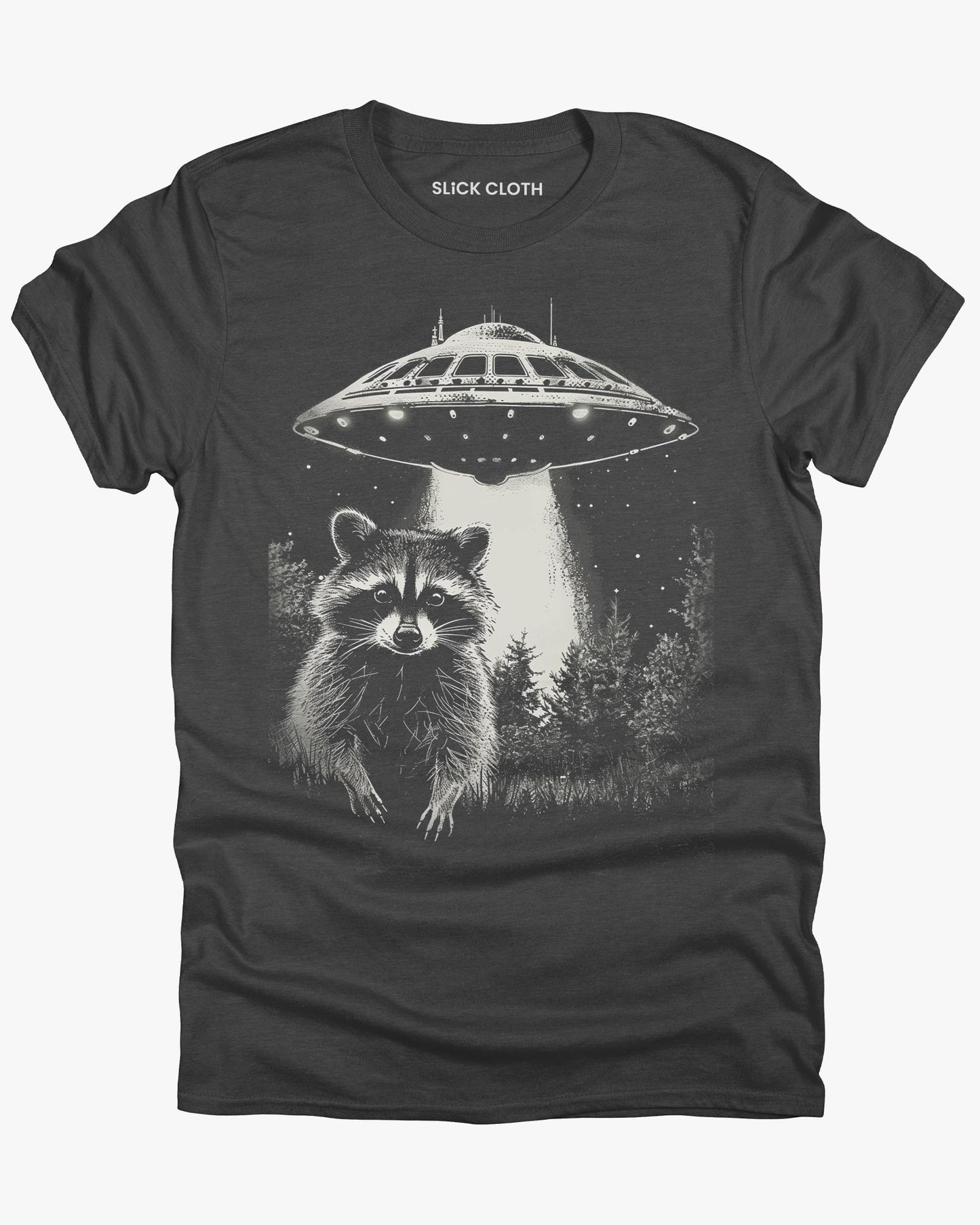 Flat lay dark heather 'Raccoon UFO' t-shirt featuring a funny graphic of a raccoon escaping a UFO abduction.