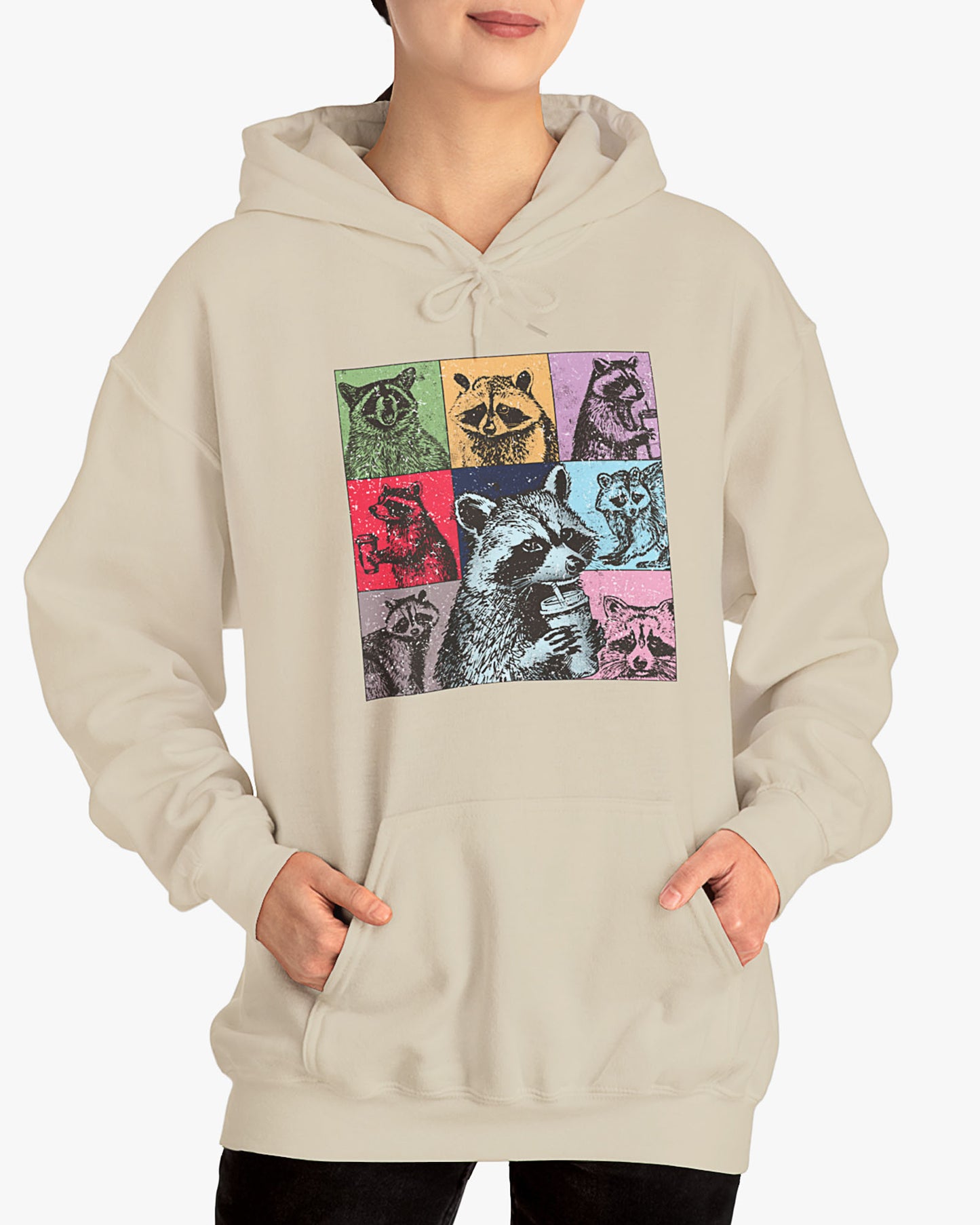 Woman wearing a sand beige hoodie with a retro and funny raccoon lifestyle collage graphic.