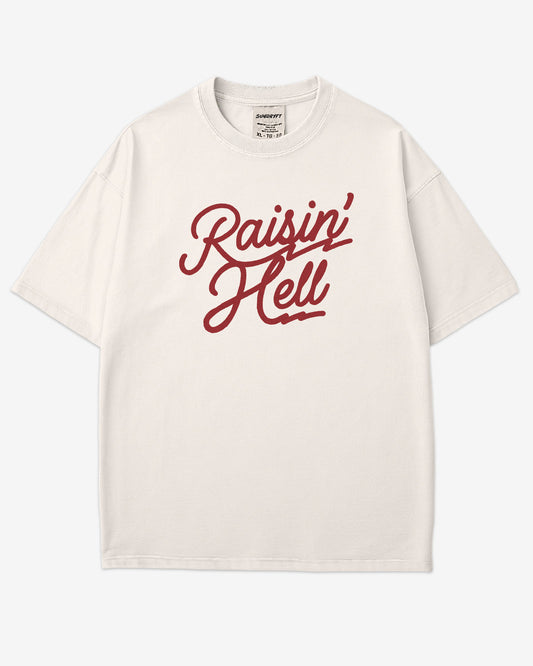 Flat lay ivory Raisin' Hell shirt.