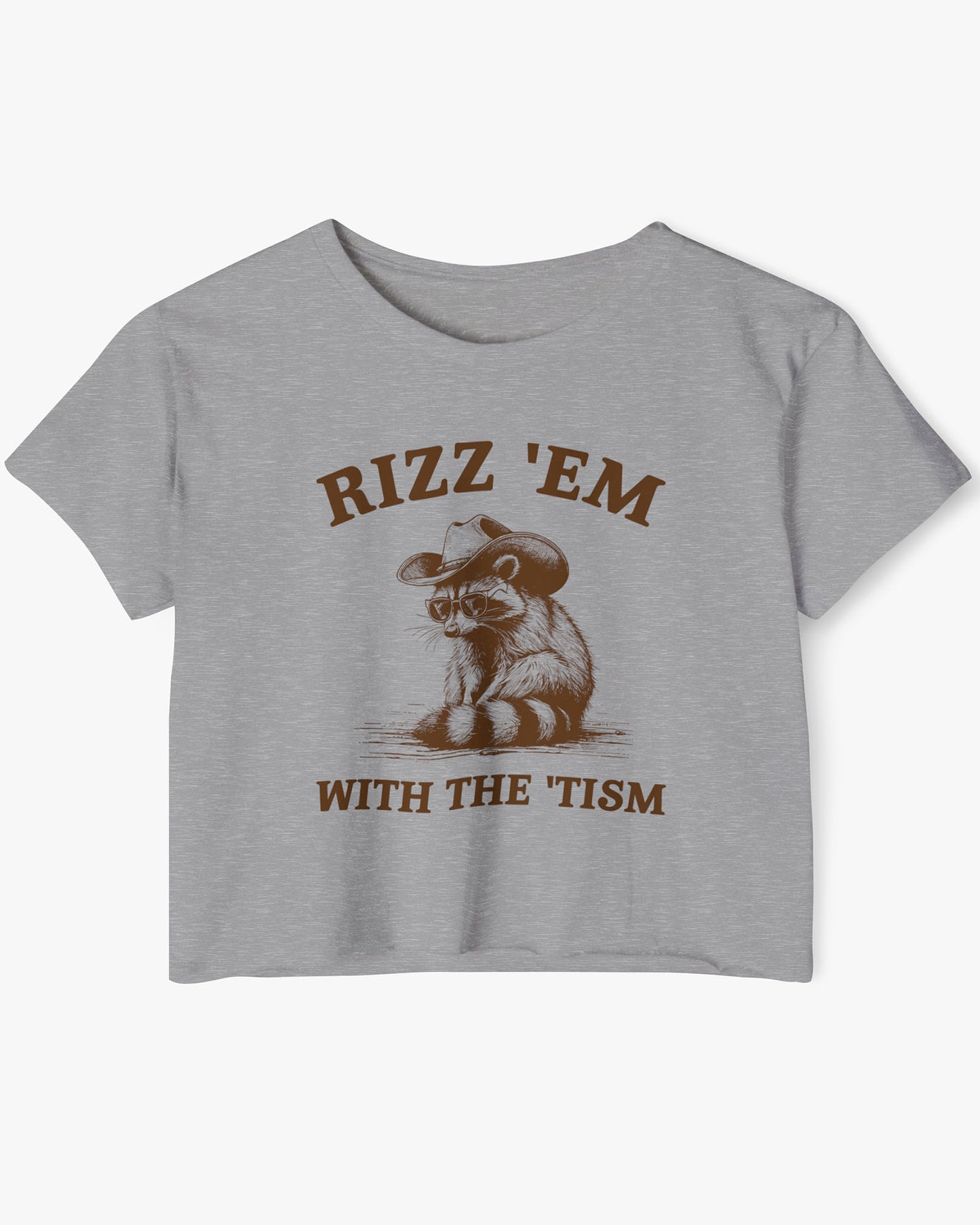 Flat lay heather gray 'Rizz Em With The Tism' crop top featuring a funny retro cowboy raccoon graphic.