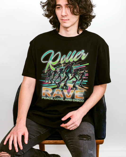 Man wearing a black 'Roller Rave – Peace, Love, and Disco' shirt with a retro 80’s graphic of a roller skater group vibing at a roller skating rink.
