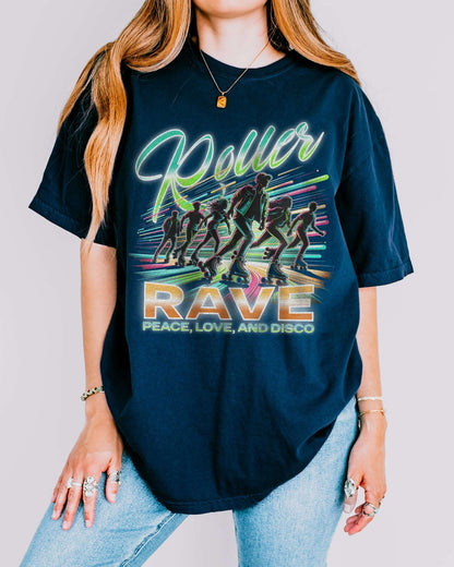 Woman wearing a navy 'Roller Rave – Peace, Love, and Disco' shirt with a retro 80’s graphic of a roller skater group vibing at a roller skating rink.