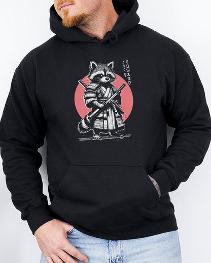 Man wearing a black hoodie featuring a retro funny samurai raccoon graphic with the quote 'Fight Me Coward' in a Japanese-style font.