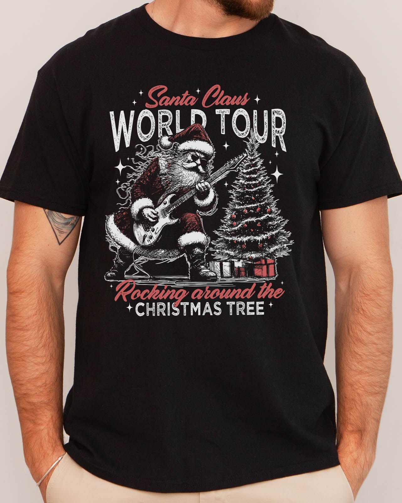 Man wearing retro graphic Santa Claus World Tour Shirt in black color