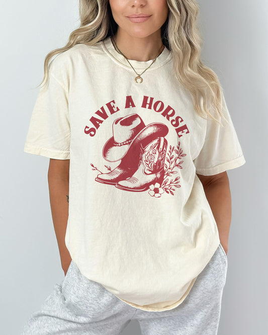 Model wearing natural color shirt with 'Save A Horse' graphic design