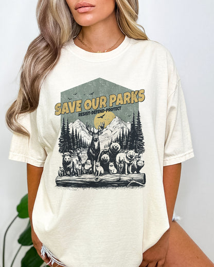 Model wearing natural color shirt with 'Save Our Parks' graphic design