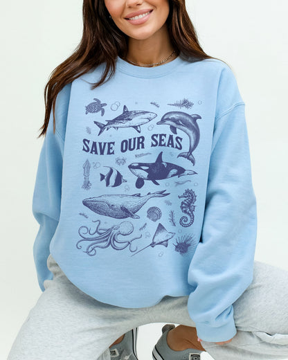 Model wearing light blue color sweatshirt with 'Save Our Seas' graphic design