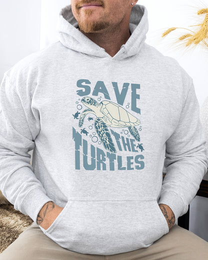 Man wearing an ash gray hoodie with a retro turtles graphic collage and the quote 'Save The Turtles'.