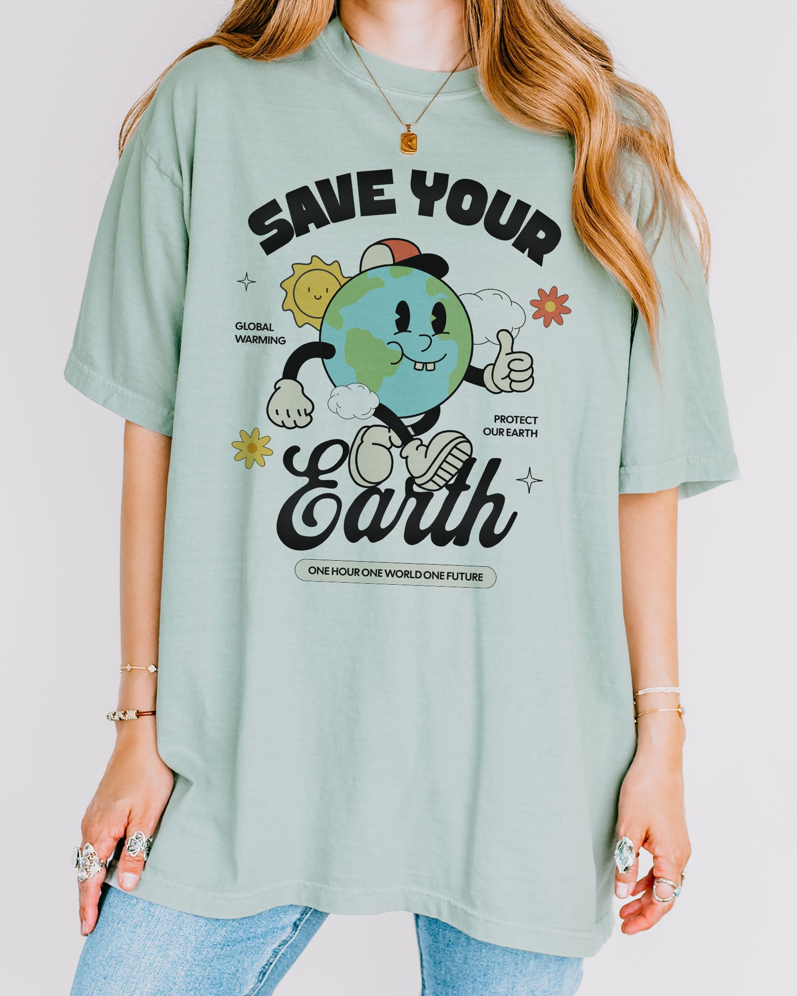Woman wearing Save Your Earth shirt in bay color with retro globe earth day graphic