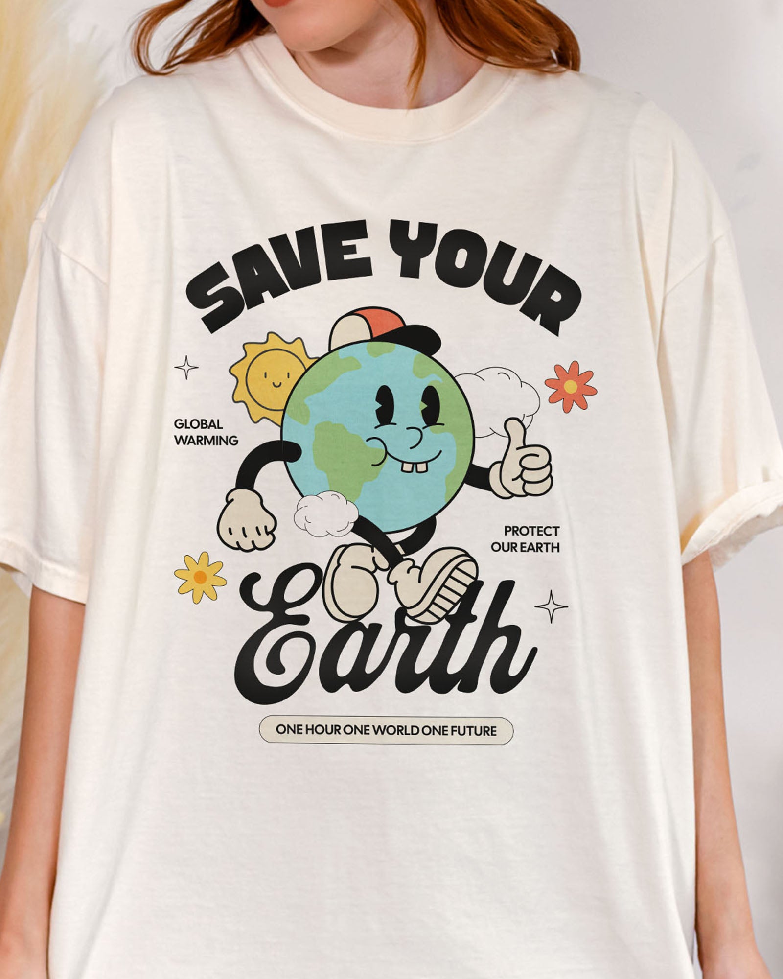 Close-up of Save Your Earth shirt in ivory color with retro globe earth day graphic