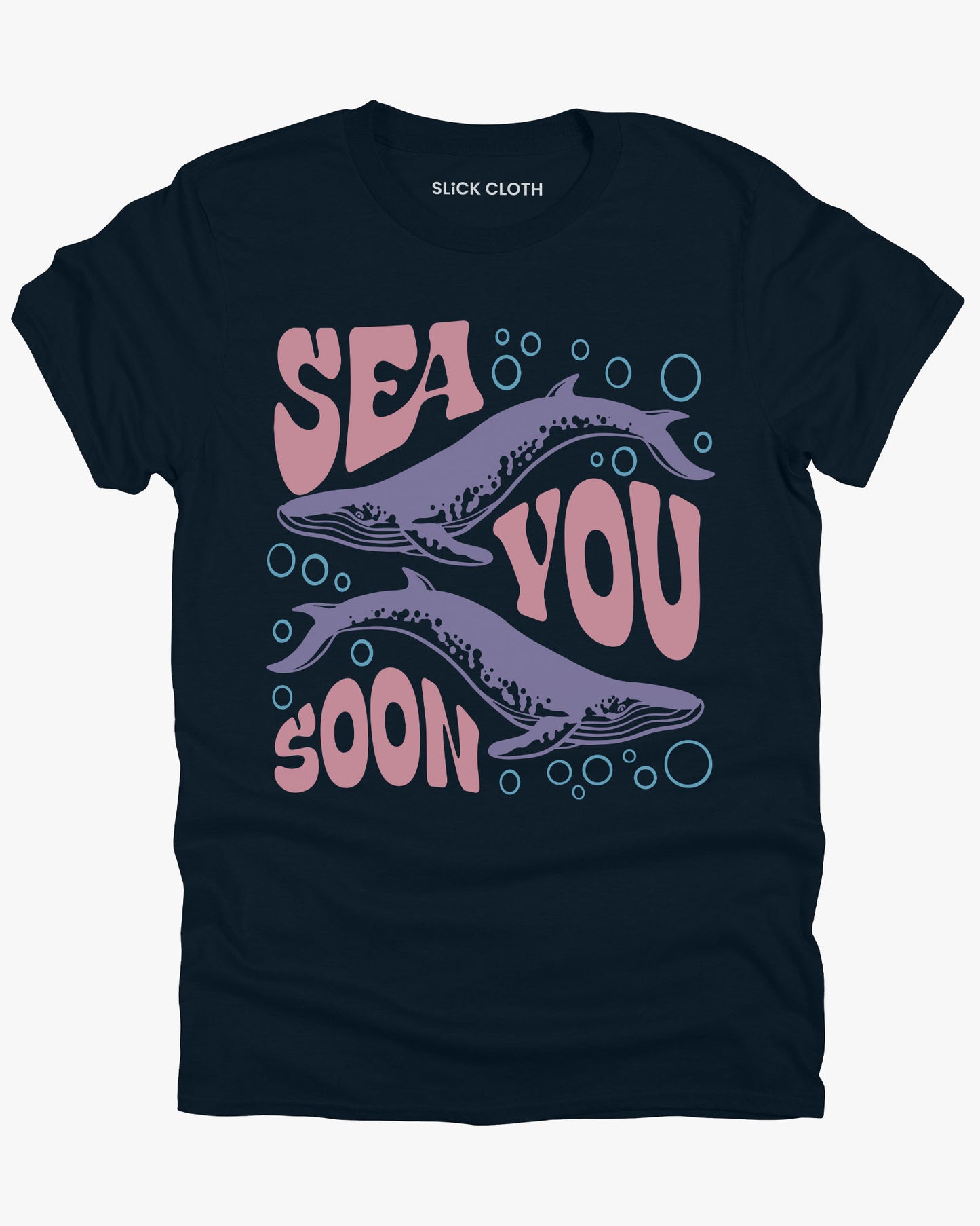 Flat lay of a midnight blue 'Sea You Soon' t-shirt with a retro whales and sea life graphic.