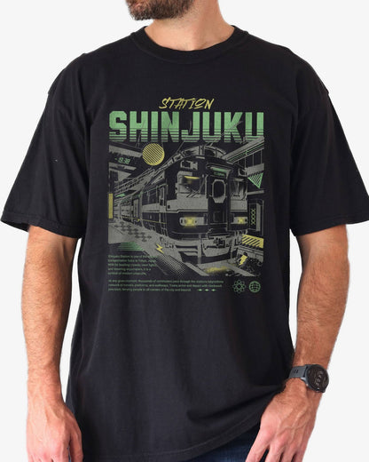 Man wearing black Shinjuku Train Station Tokyo retro graphic shirt.