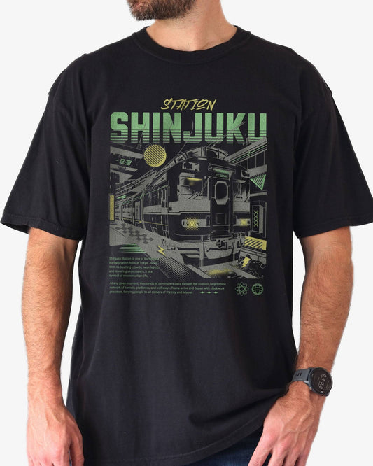 Man wearing black Shinjuku Train Station Tokyo retro graphic shirt.
