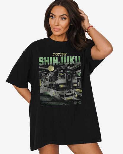 Woman wearing black Shinjuku Train Station Tokyo retro graphic shirt.