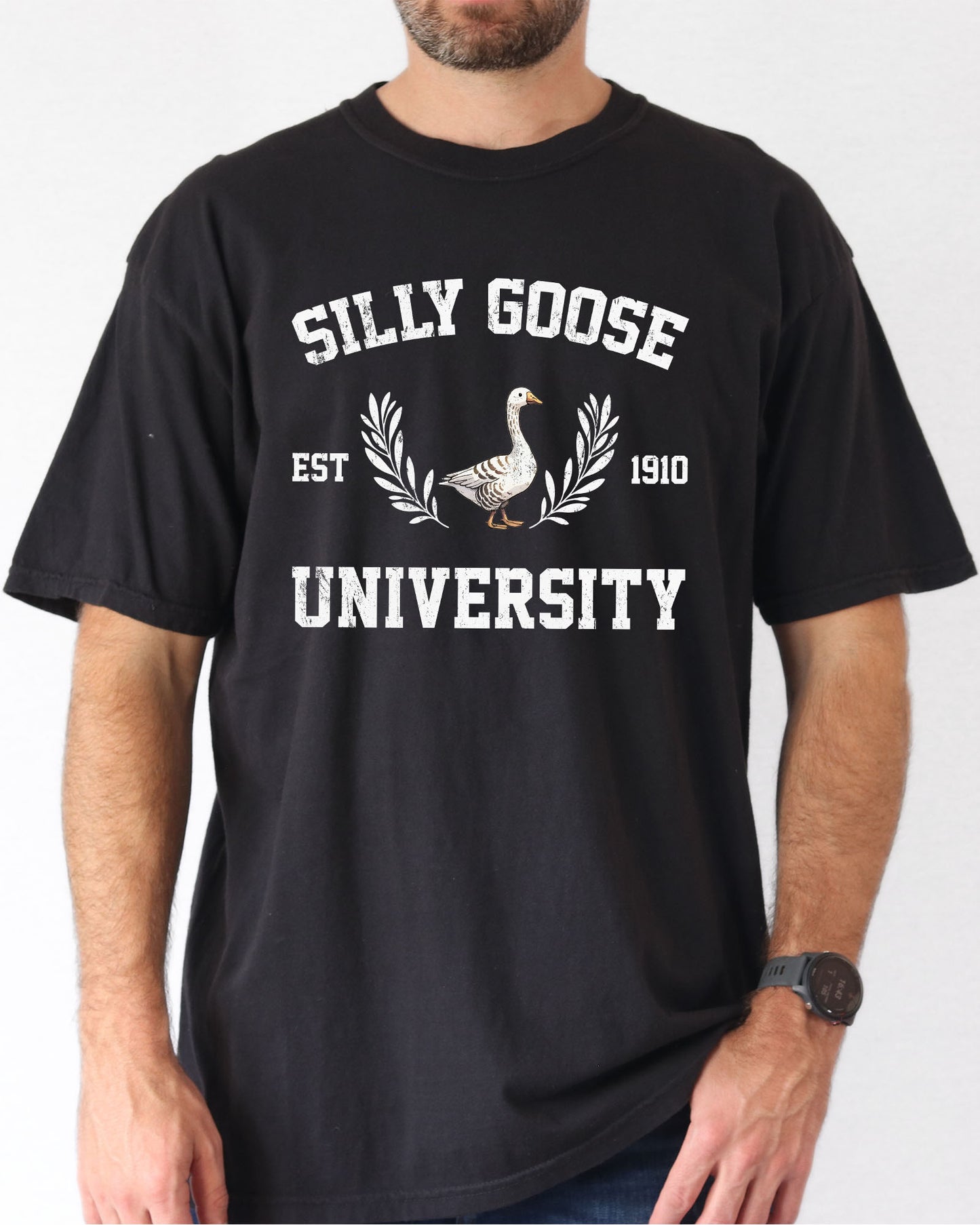 Model wearing black color sweatshirt with Silly Goose University graphic design