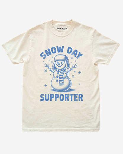 Snow Day Supporter shirt in ivory with snowman graphic