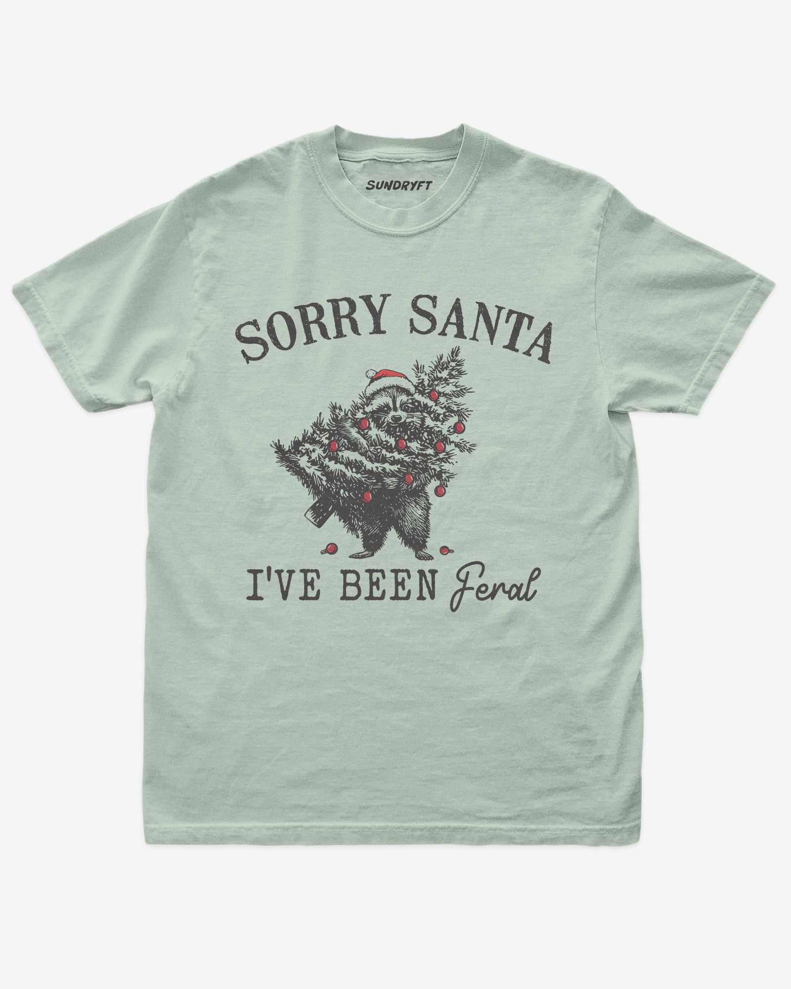 Sorry Santa I've Been Feral shirt in bay with raccoon eating Christmas tree graphic
