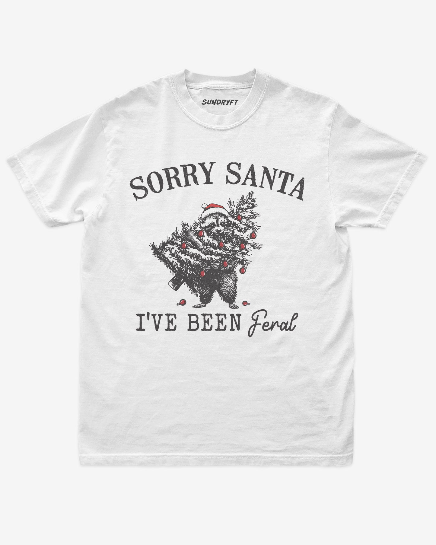 Sorry Santa I've Been Feral shirt in white with raccoon eating Christmas tree graphic