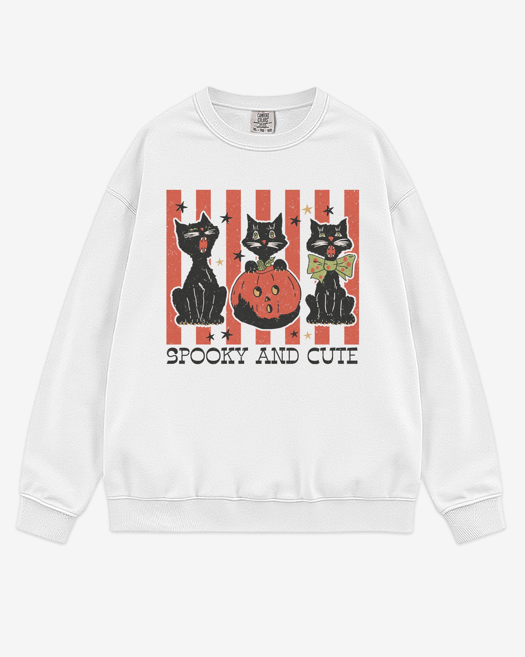 Flat lay white-colored 'Spooky And Cute' sweatshirt with retro Halloween graphic of three black cats and a pumpkin.