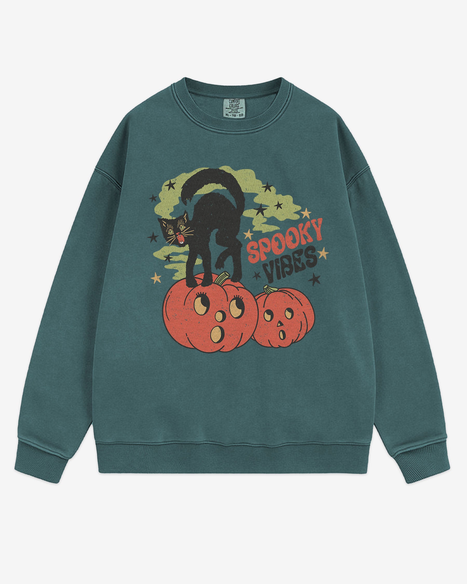 Flat lay blue spruce Halloween sweatshirt reading ‘Spooky Vibes’ with retro graphic of black cat standing on pumpkins.