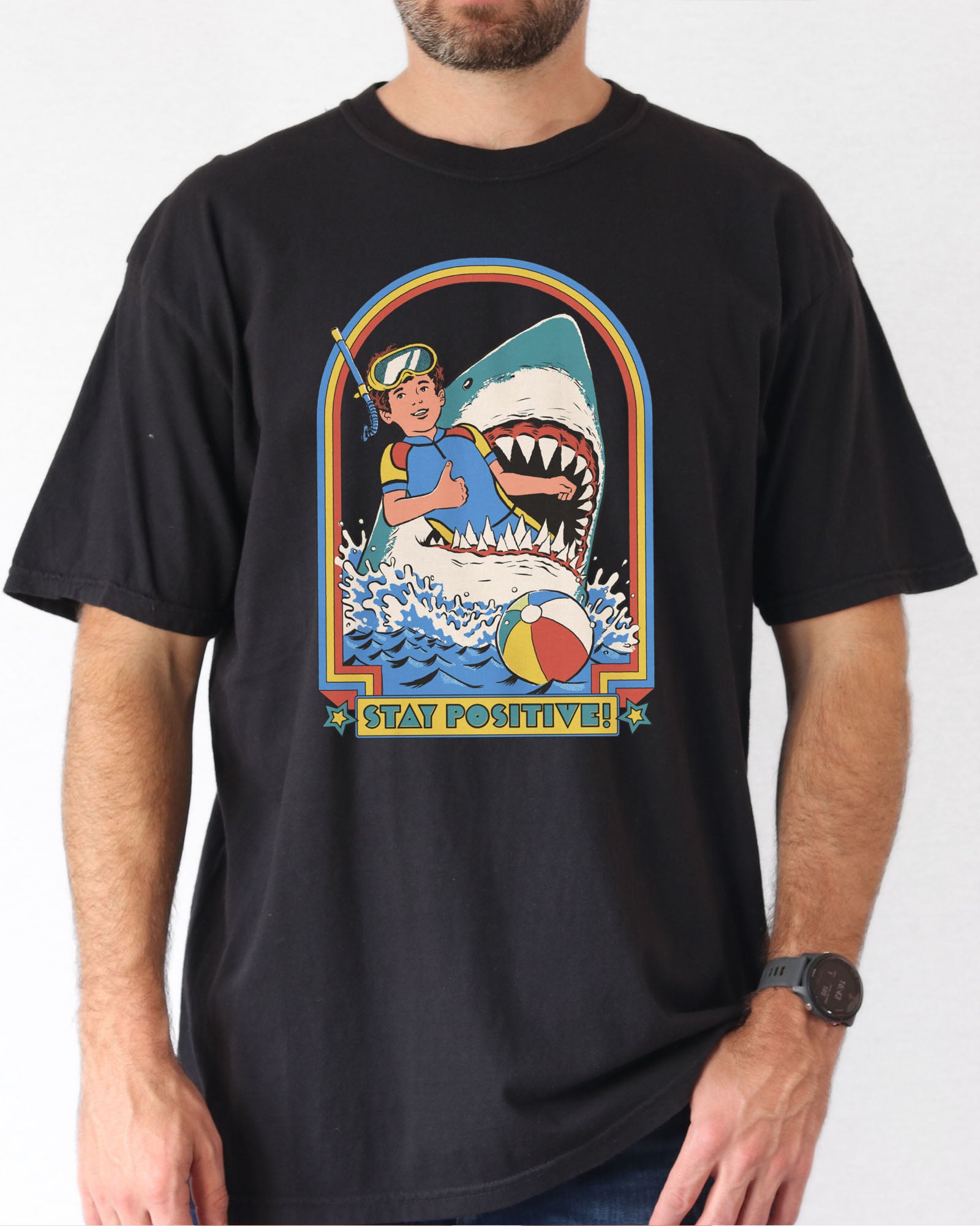 Model wearing black color shirt with 'Stay Positive' diver in sharks mouth graphic design