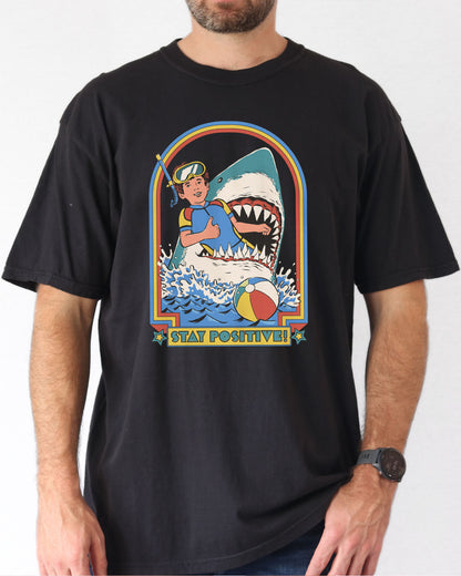 Model wearing black color shirt with 'Stay Positive' diver in sharks mouth graphic design