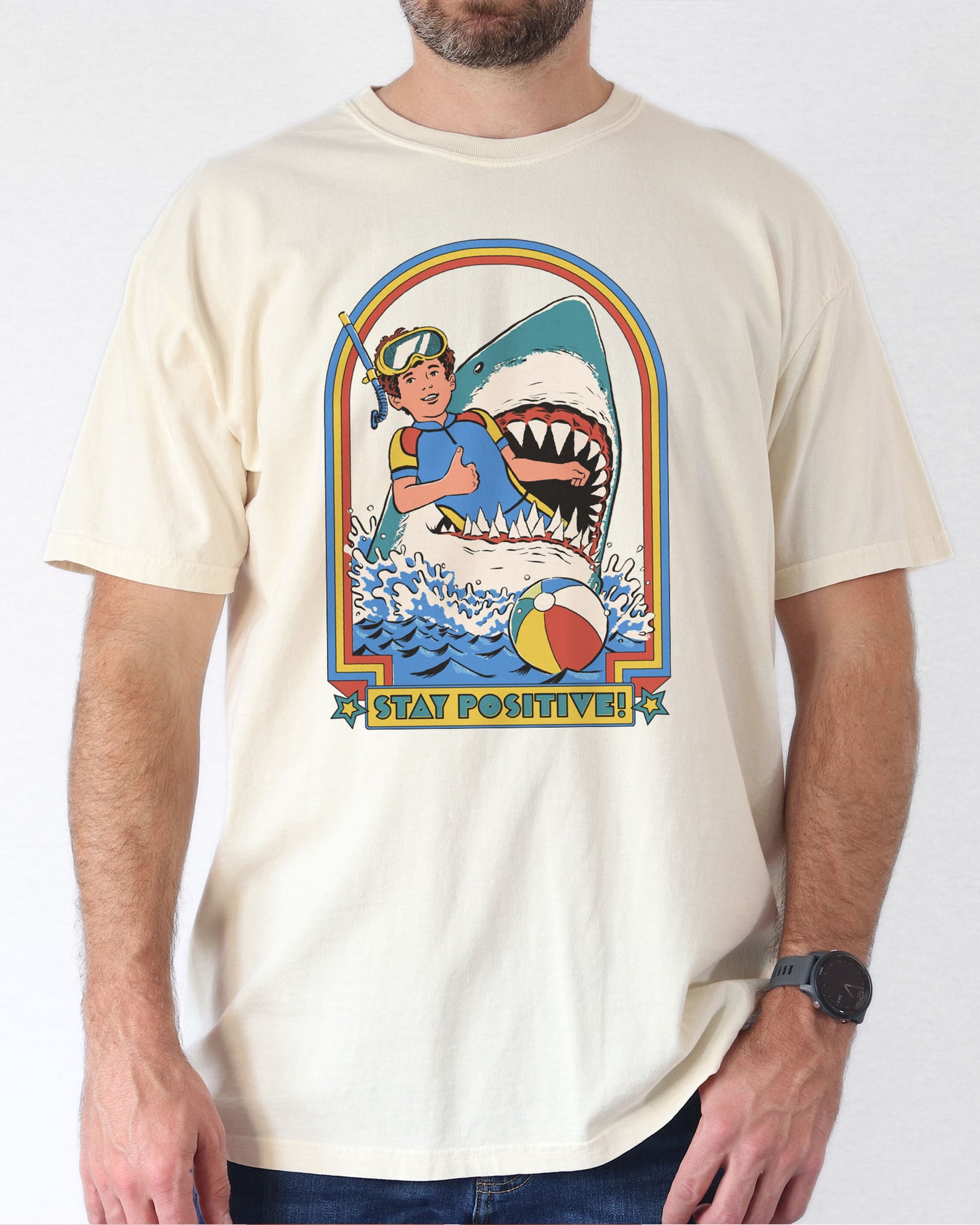 Model wearing natural color shirt with 'Stay Positive' diver in sharks mouth graphic design