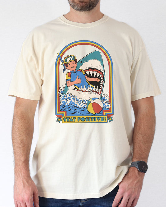 Model wearing natural color shirt with 'Stay Positive' diver in sharks mouth graphic design