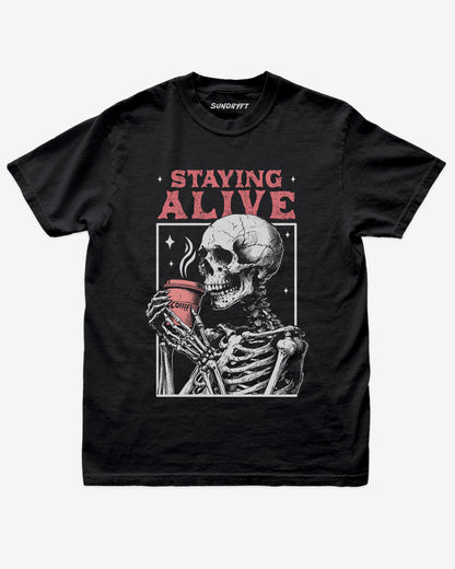 Staying Alive shirt in black with skeleton drinking coffee graphic