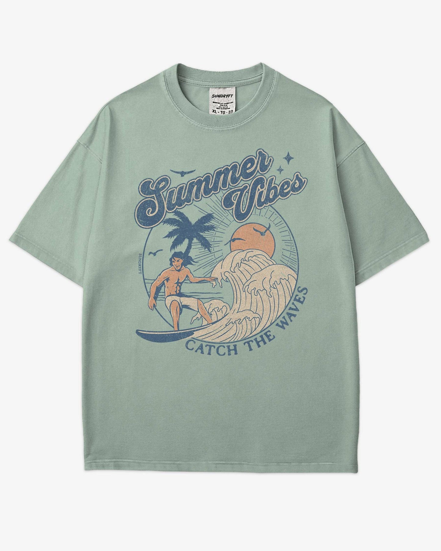 Flat lay bay 'Summer Vibes – Catch the Waves' surf shirt with a retro graphic of a surfer riding a wave on the beach.