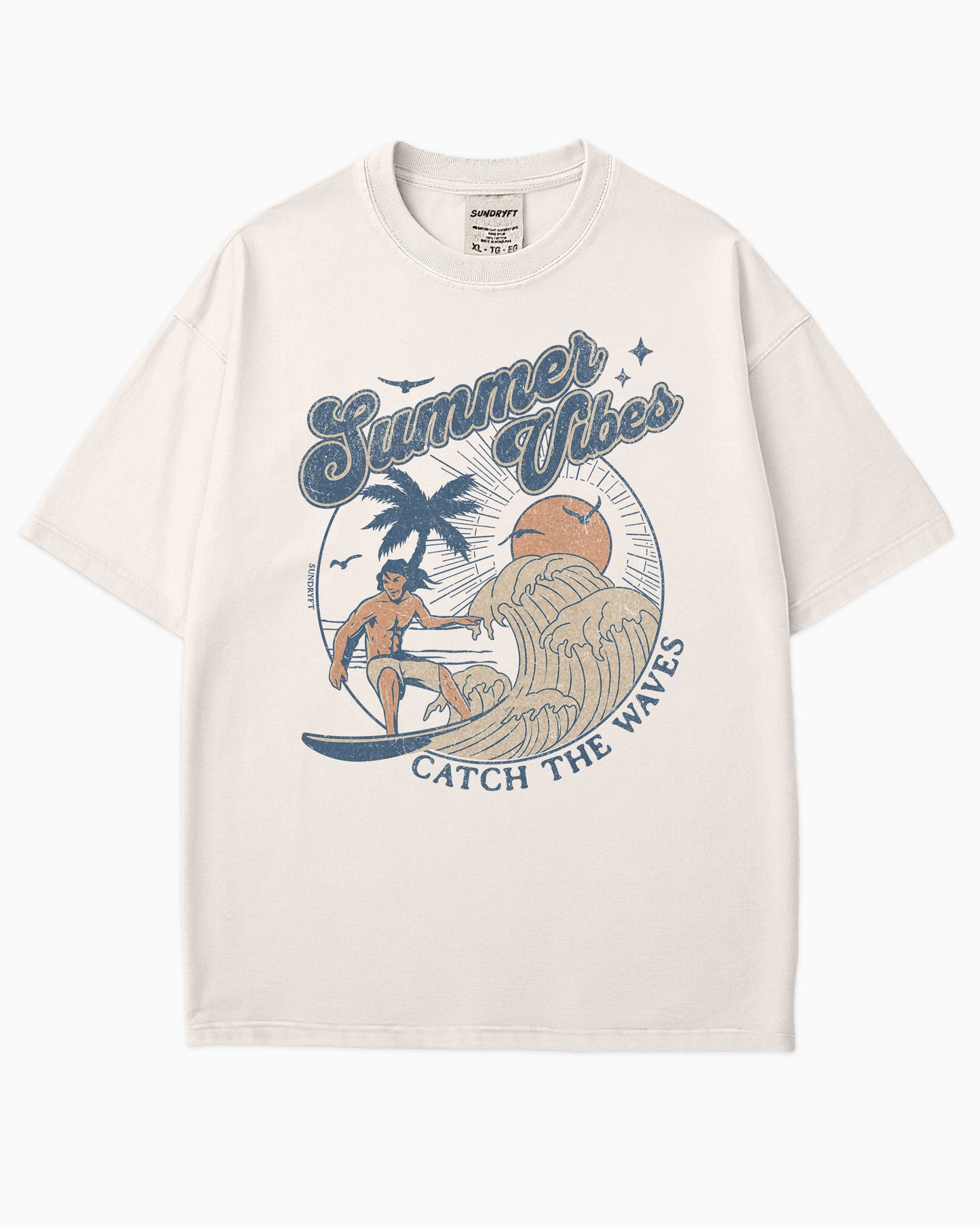 Flat lay ivory 'Summer Vibes – Catch the Waves' surf shirt with a retro graphic of a surfer riding a wave on the beach.