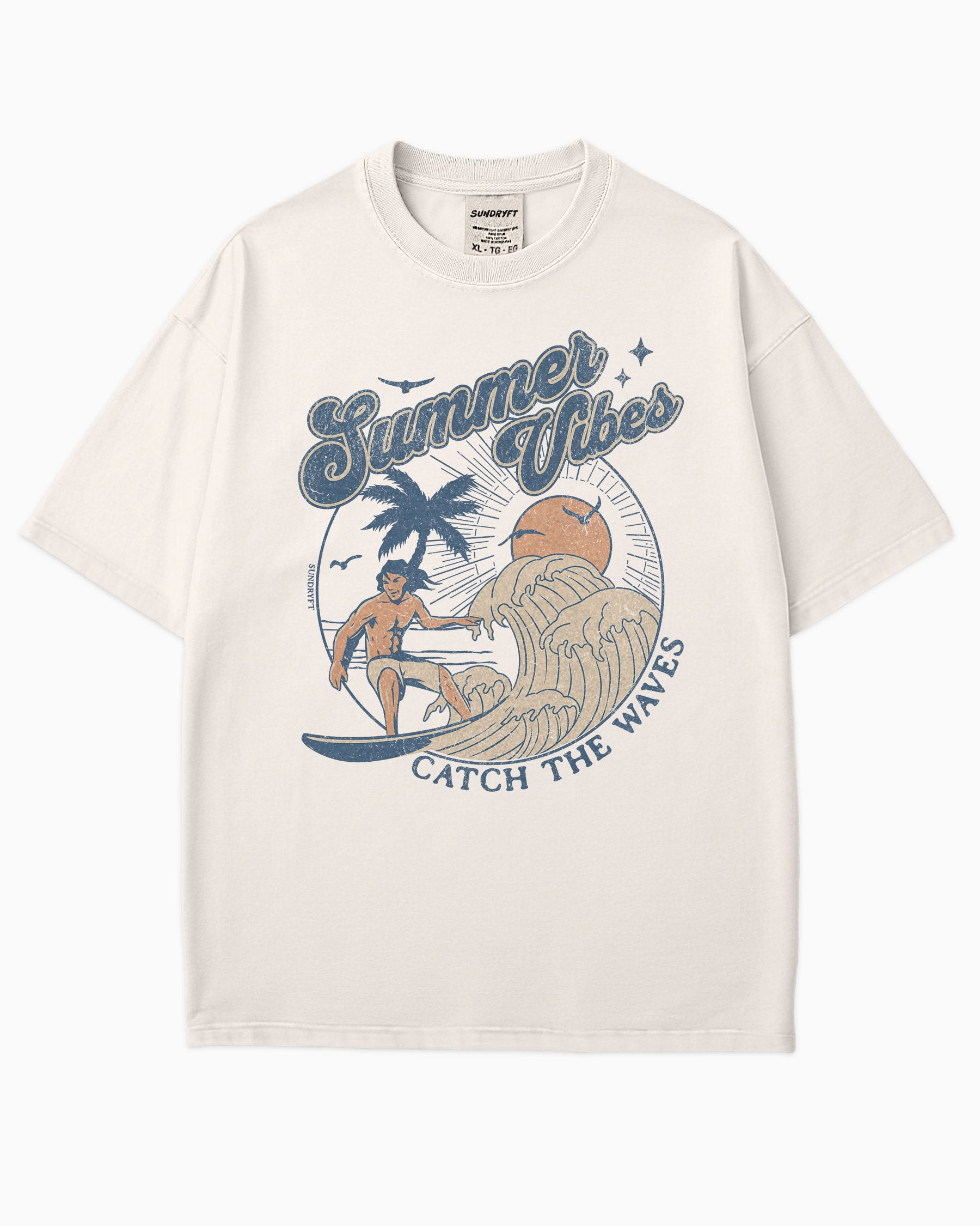 Flat lay ivory 'Summer Vibes – Catch the Waves' surf shirt with a retro graphic of a surfer riding a wave on the beach.
