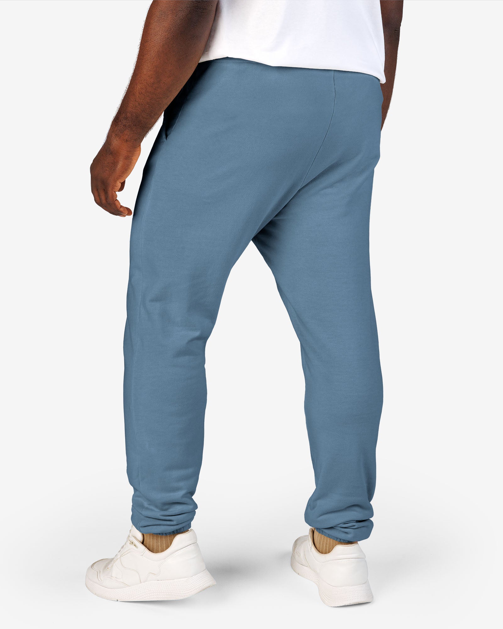 Man wearing blue jean color Sundryft unisex fleece sweatpants.