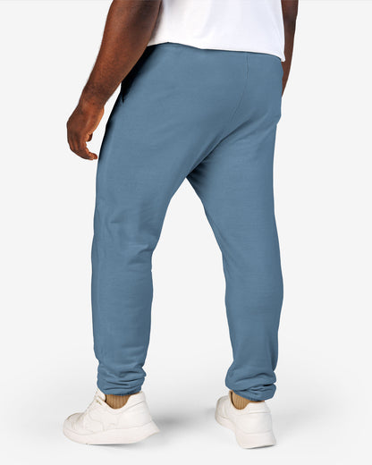 Man wearing blue jean color Sundryft unisex fleece sweatpants.