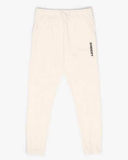 Flat lay ivory color Sundryft unisex fleece sweatpants.