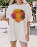 Model wearing ivory color shirt with retro sunset graphic design