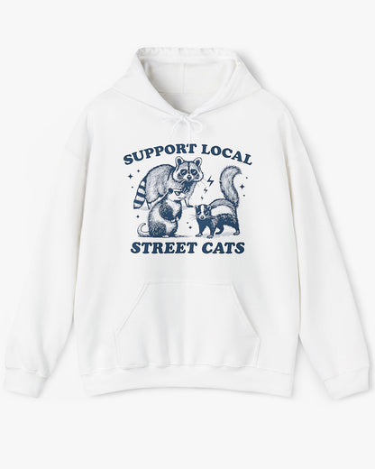 Flat lay white 'Support Local Street Cats' hoodie with a funny raccoon and opossum retro graphic