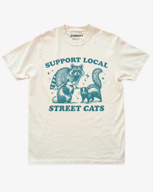 Support Local Street Cats shirt in ivory with funny graphic of raccoon, opossum, and skunk wearing sunglasses