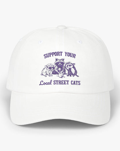 White dad cap with the quote 'Support Your Local Street Cats' and a funny retro raccoon and opossum graphic.