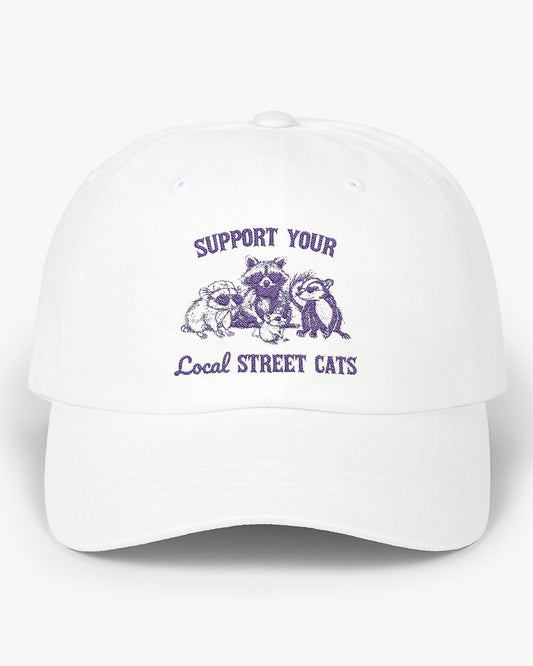 White dad cap with the quote 'Support Your Local Street Cats' and a funny retro raccoon and opossum graphic.
