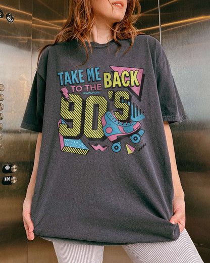 Woman wearing a pepper-colored "Take Me Back To The 90's" retro graphic shirt.