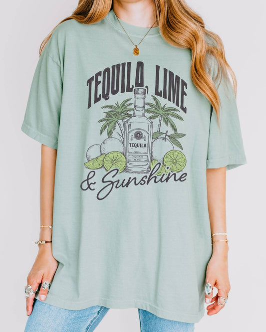 Model wearing bay color shirt with 'Tequila Lime And Sunshine' funny retro graphic design