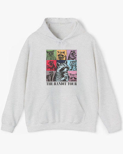 Man wearing ash gray 'The Bandit Tour' hoodie with funny retro raccoon collage 