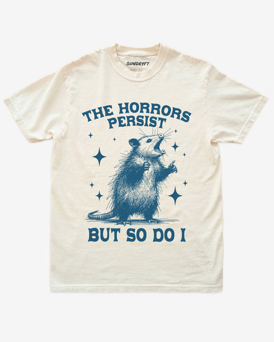 The Horrors Persist, But So Do I shirt in ivory with funny retro opossum graphic