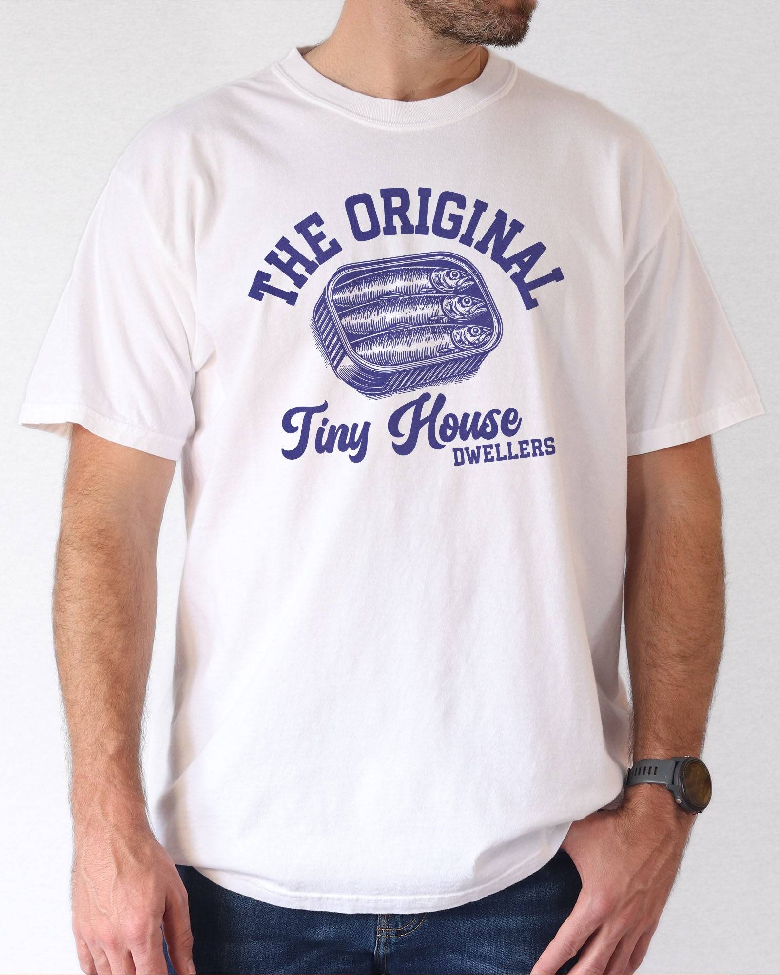 Man wearing a white "The Original Tiny House Dwellers" shirt featuring a retro graphic of sardines packed in a tin can.