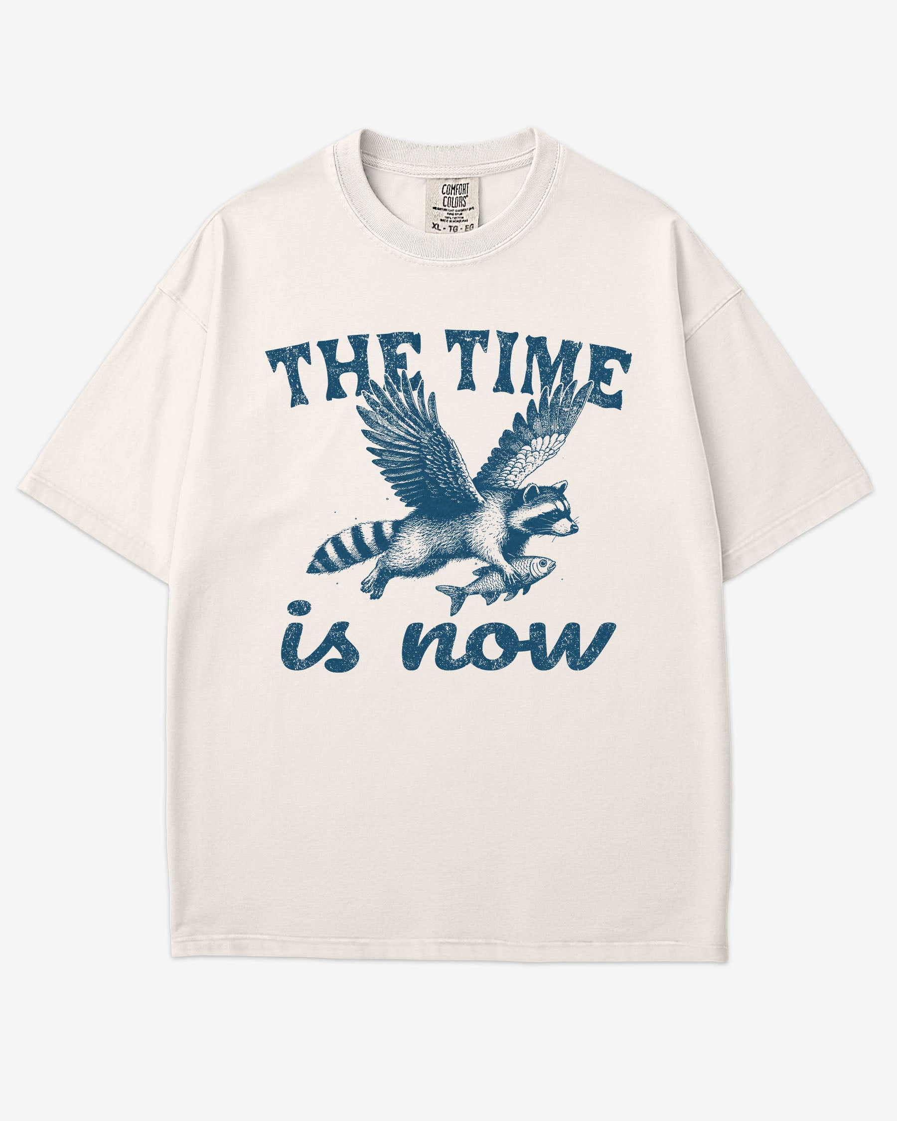 The Time Is Now Shirt flat lay unisex ivory retro tee with funny flying raccoon graphic