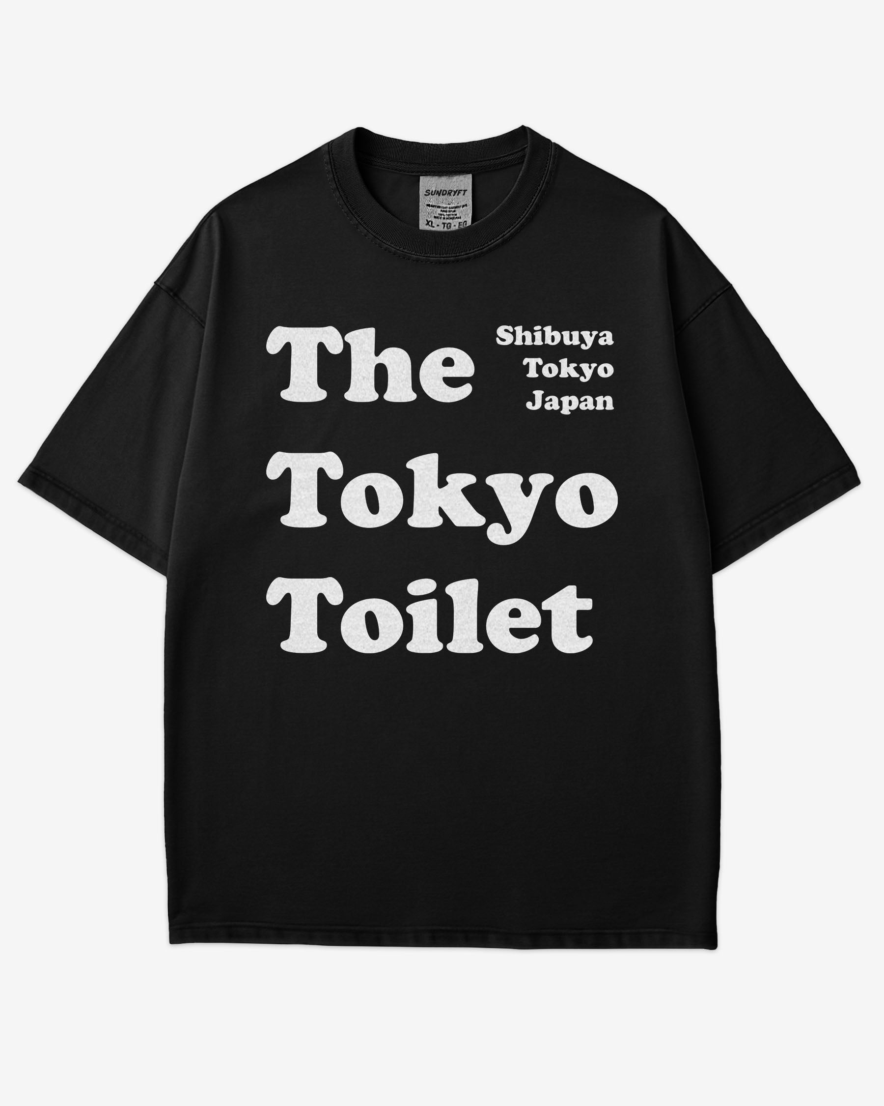 Flat lay black Tokyo Toilet shirt with a retro graphic inspired by Shibuya’s public restrooms.
