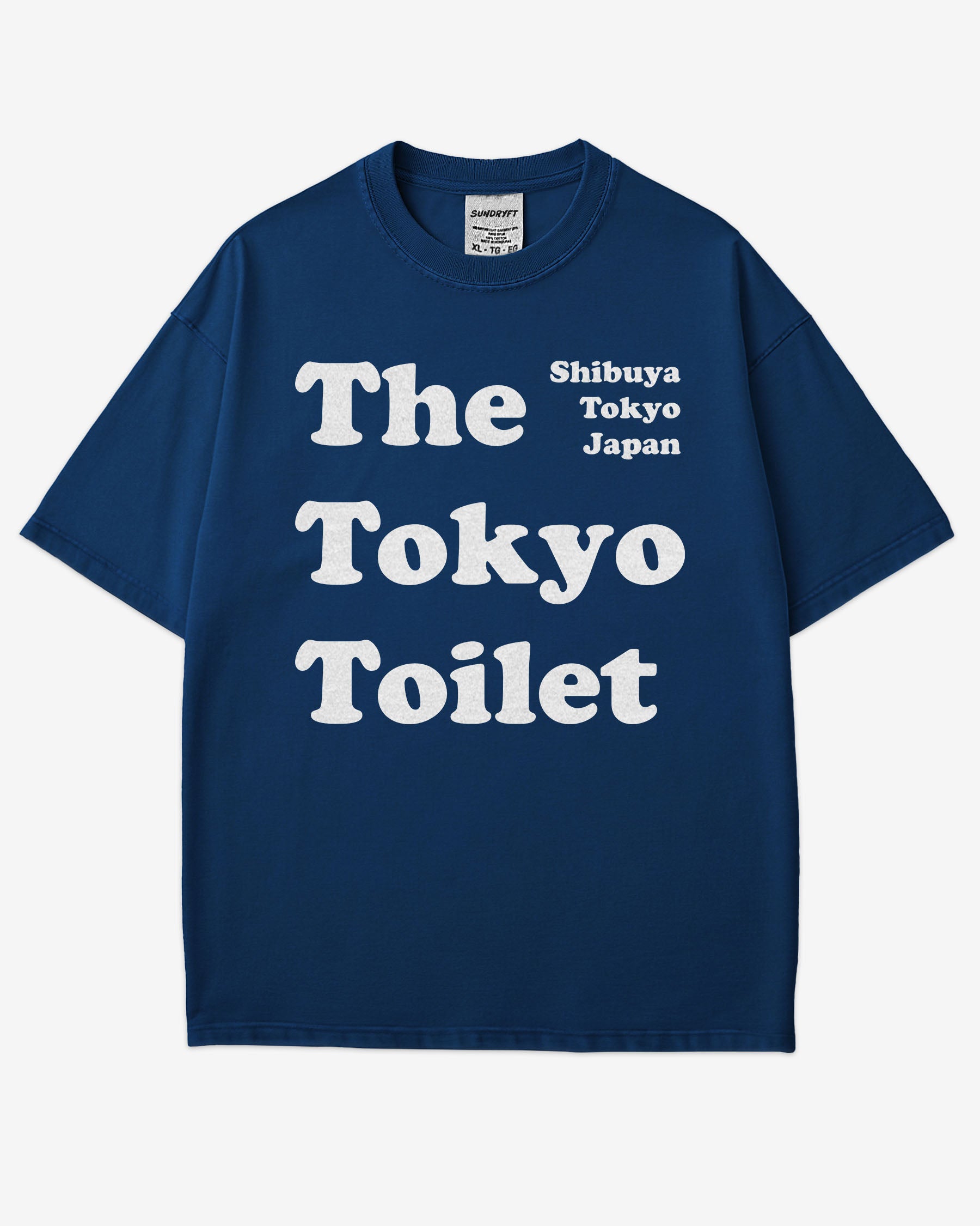 Flat lay true navy Tokyo Toilet shirt with a retro graphic inspired by Shibuya’s public restrooms.