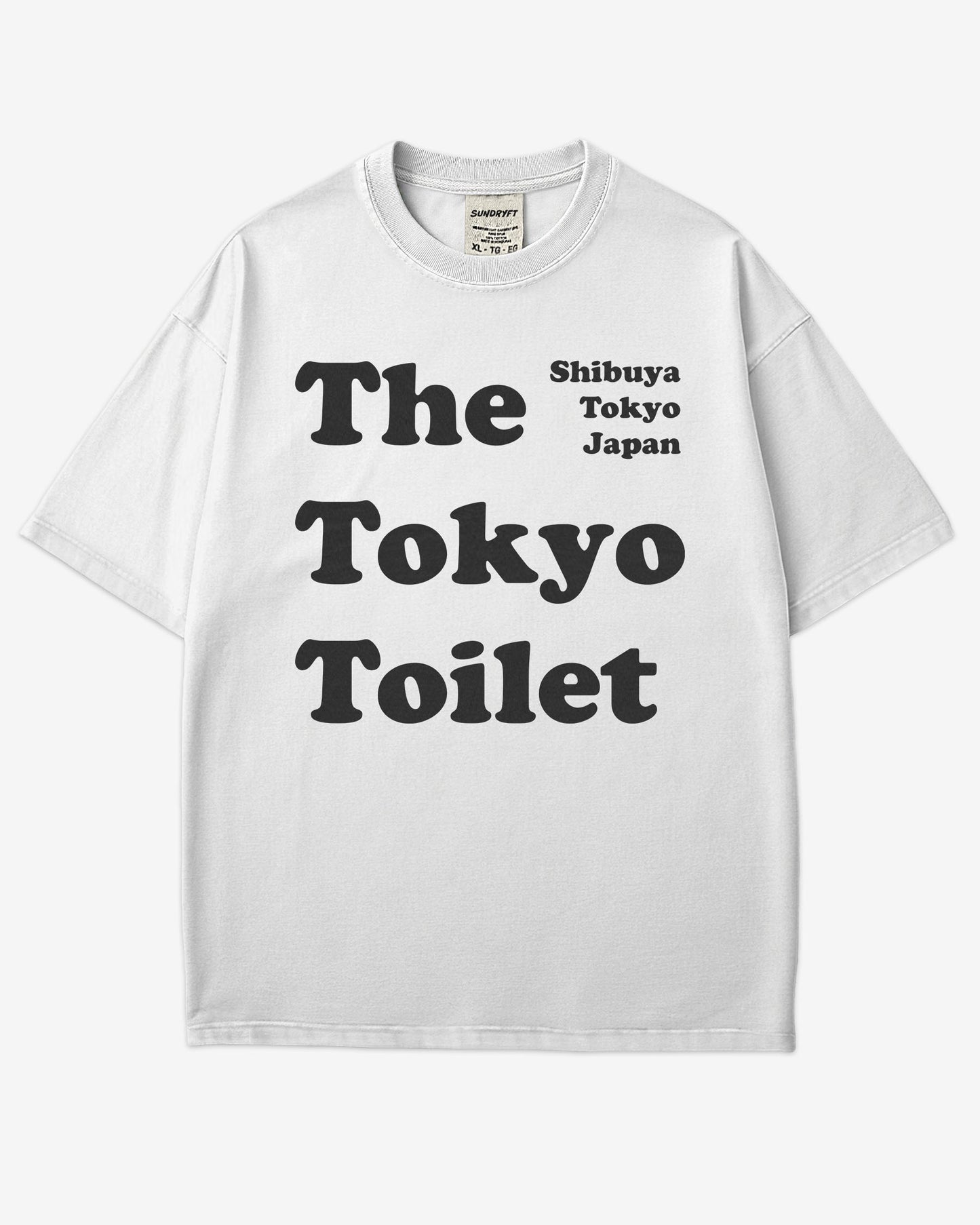 Flat lay white Tokyo Toilet shirt with a retro graphic inspired by Shibuya’s public restrooms.
